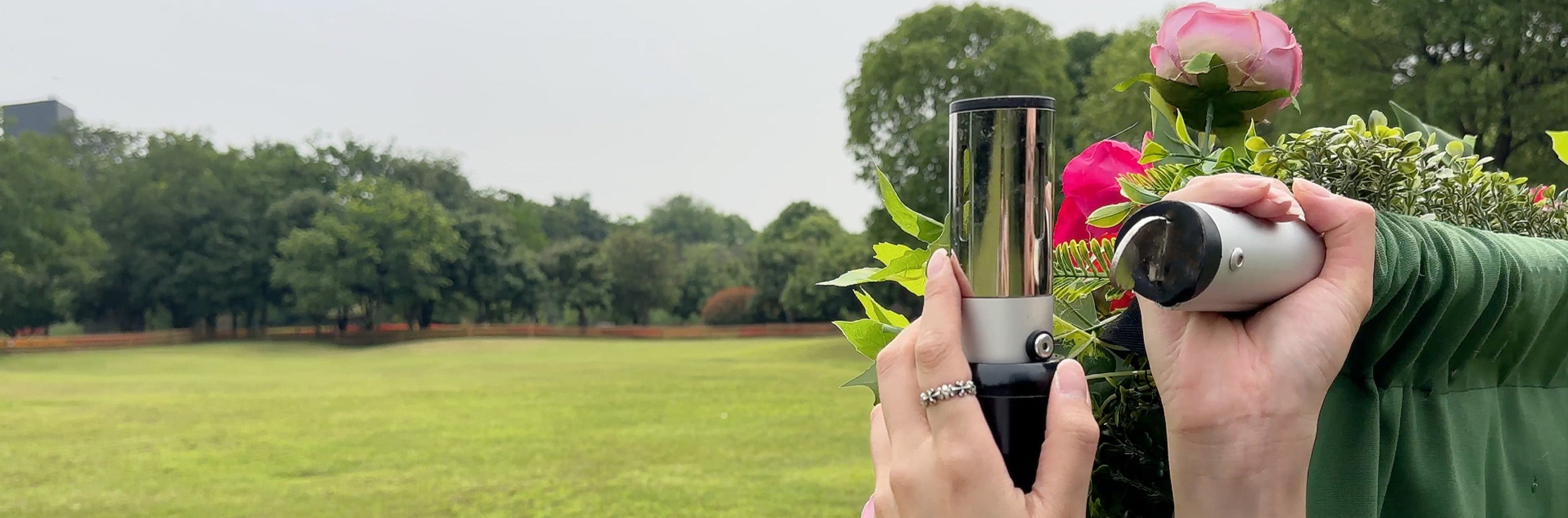 Person attaching the crossbar to the flower wall stand—demonstrating easy, tool-free setup process.