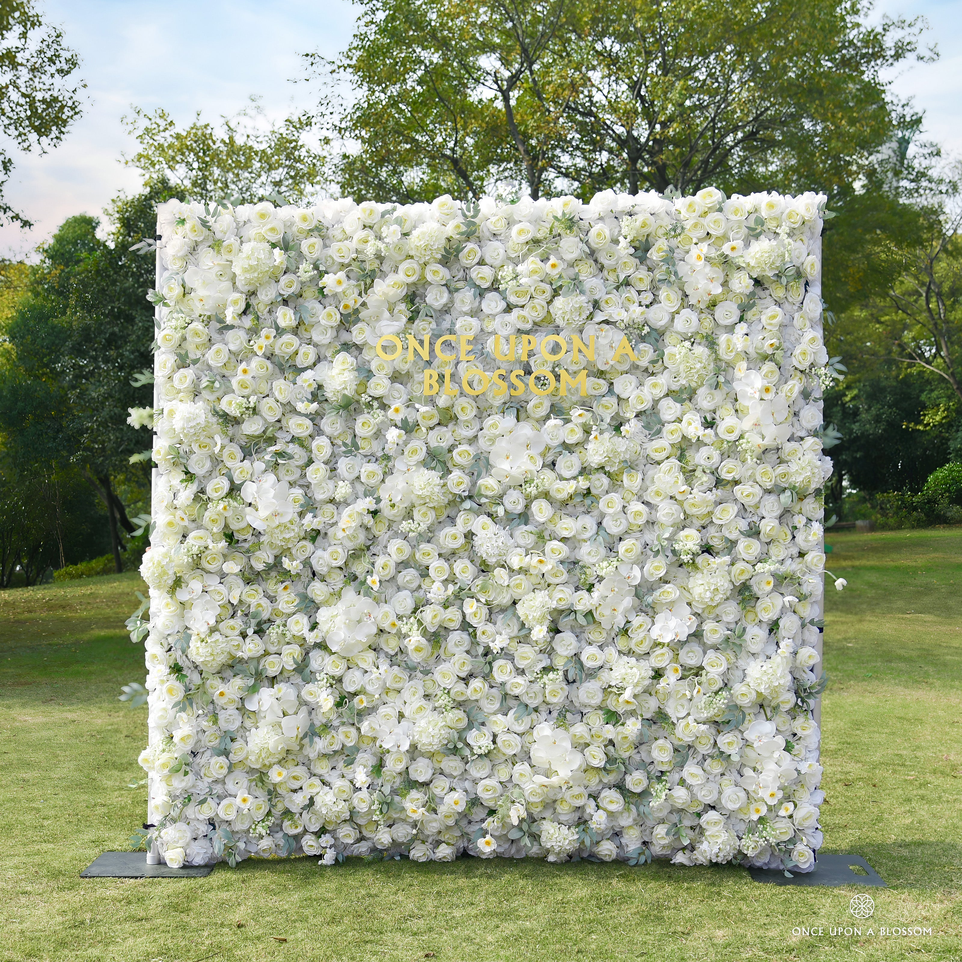 front view of ivory and green flower wall featuring roses and greenery, from our Moonlit Garden.