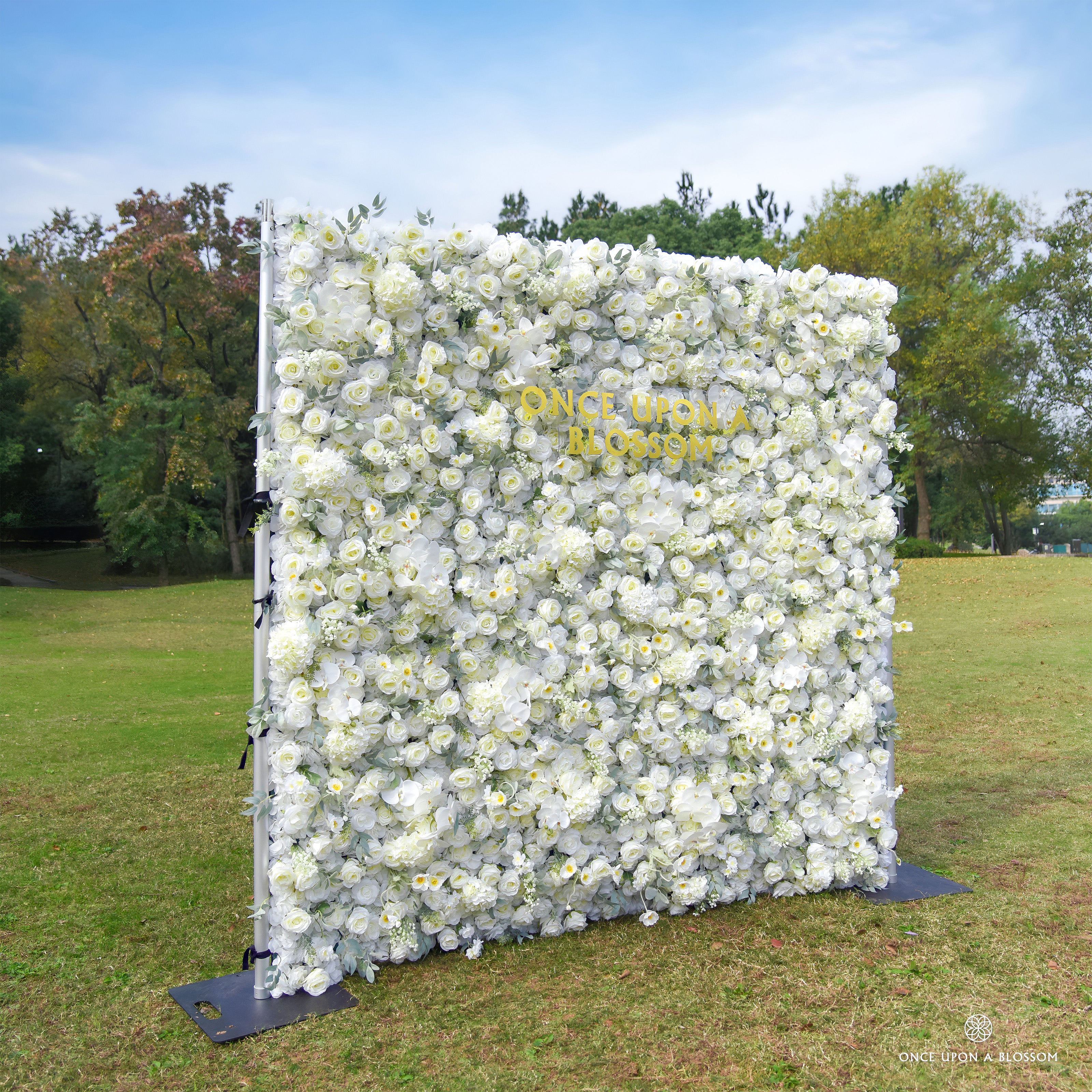 left-side view of ivory and green flower wall featuring roses and greenery, from our Moonlit Garden.