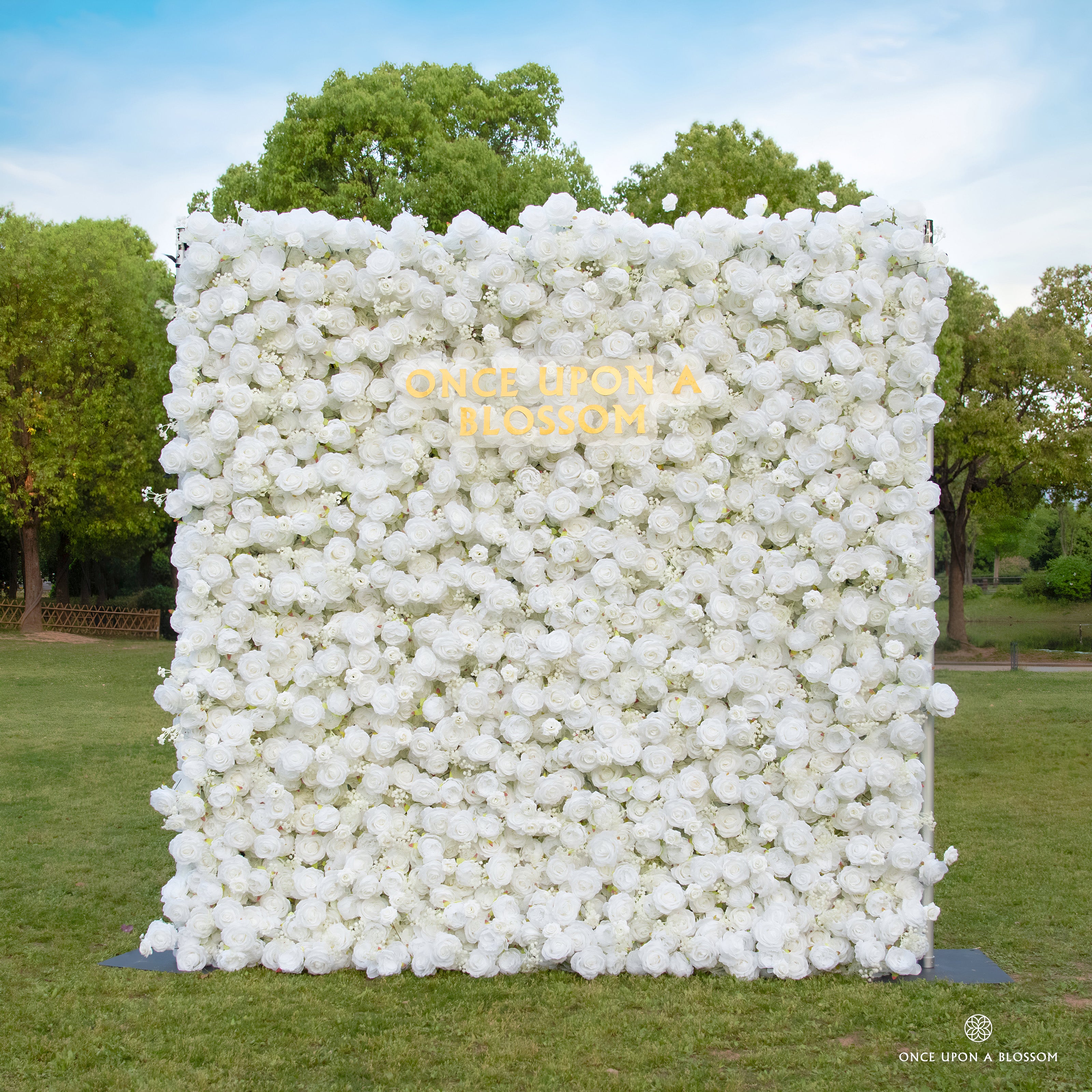 front view of white flower wall featuring white roses, from our Angel’s Breath