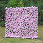 Side angle showing the fullness and layered texture of the Daydream Blush flower wall, featuring pink roses.