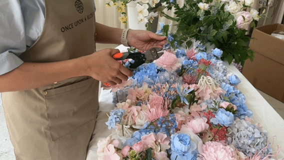 Close up of once upon a blossom flower wall handmade process