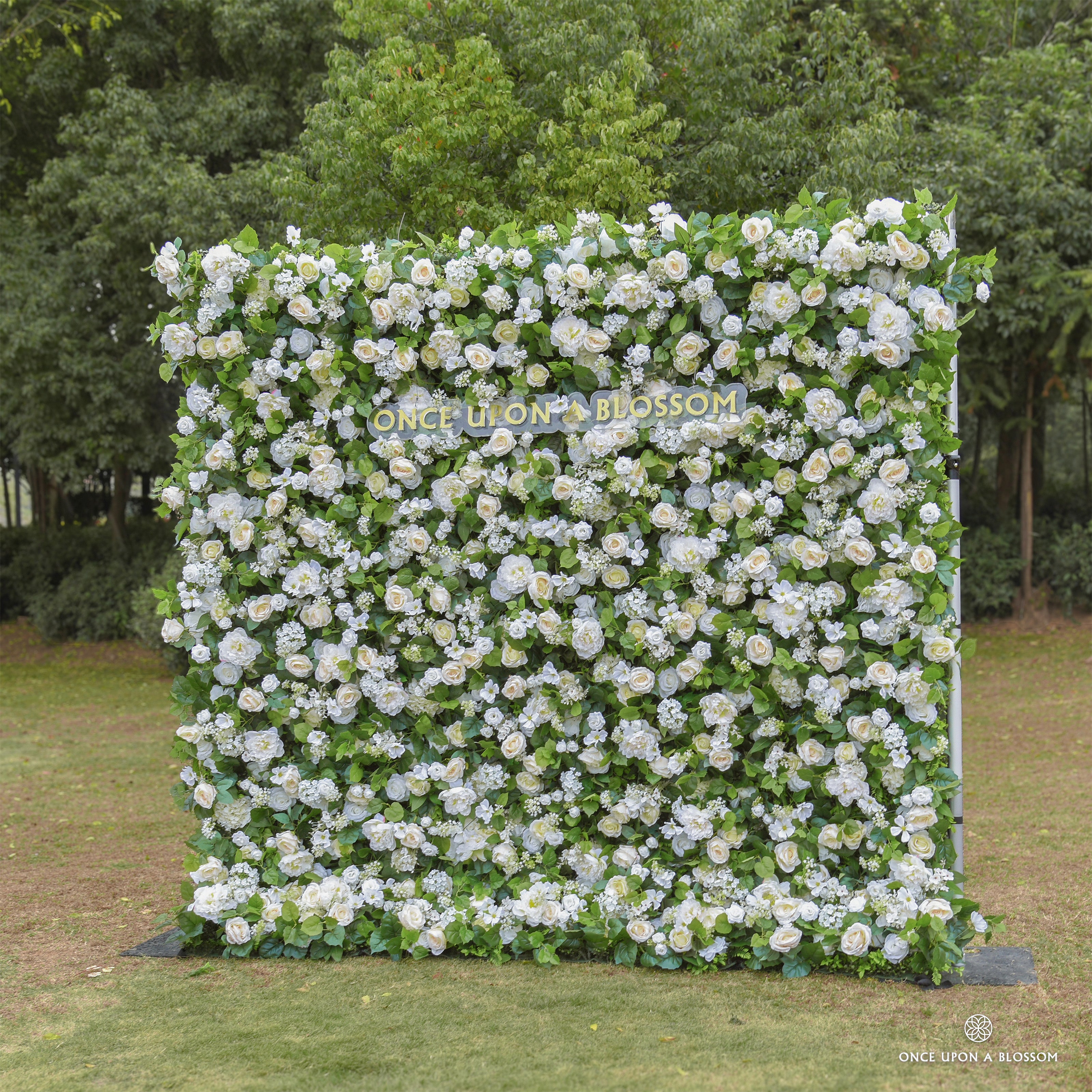 Side angle showing the layered greenery, chrysanthemums, and soft yellow blooms of the Morning Sunshine flower wall.
