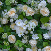 Close-up of premium silk yellow flowers and greenery on the Morning Sunshine flower wall for weddings and photo booths.