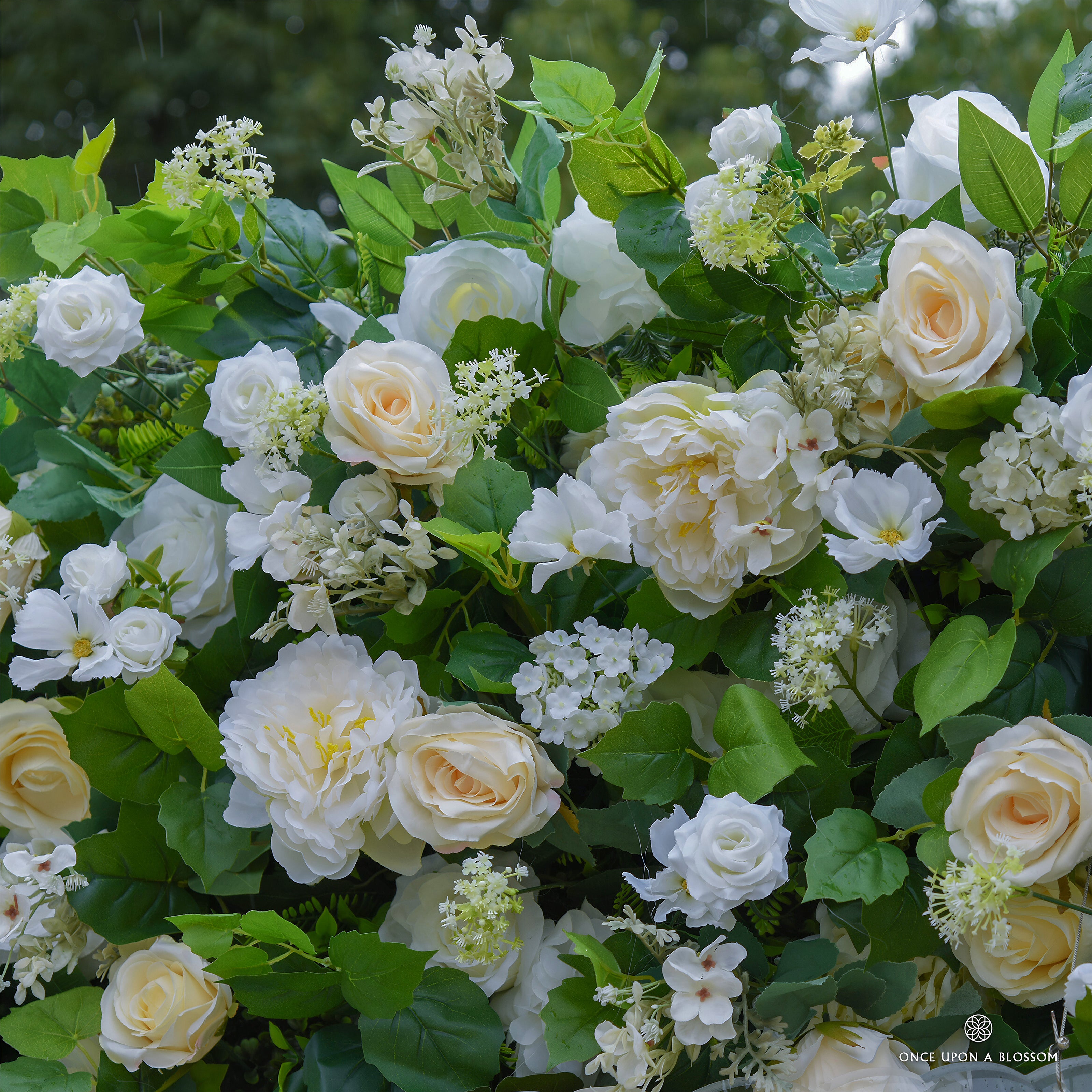 Detailed texture of yellow florals and natural greenery showing the fullness of the Morning Sunshine flower wall backdrop.