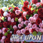 Close-up of the pink rose cluster on the Date Night red flower wall, with the Once Upon a Blossom sign below