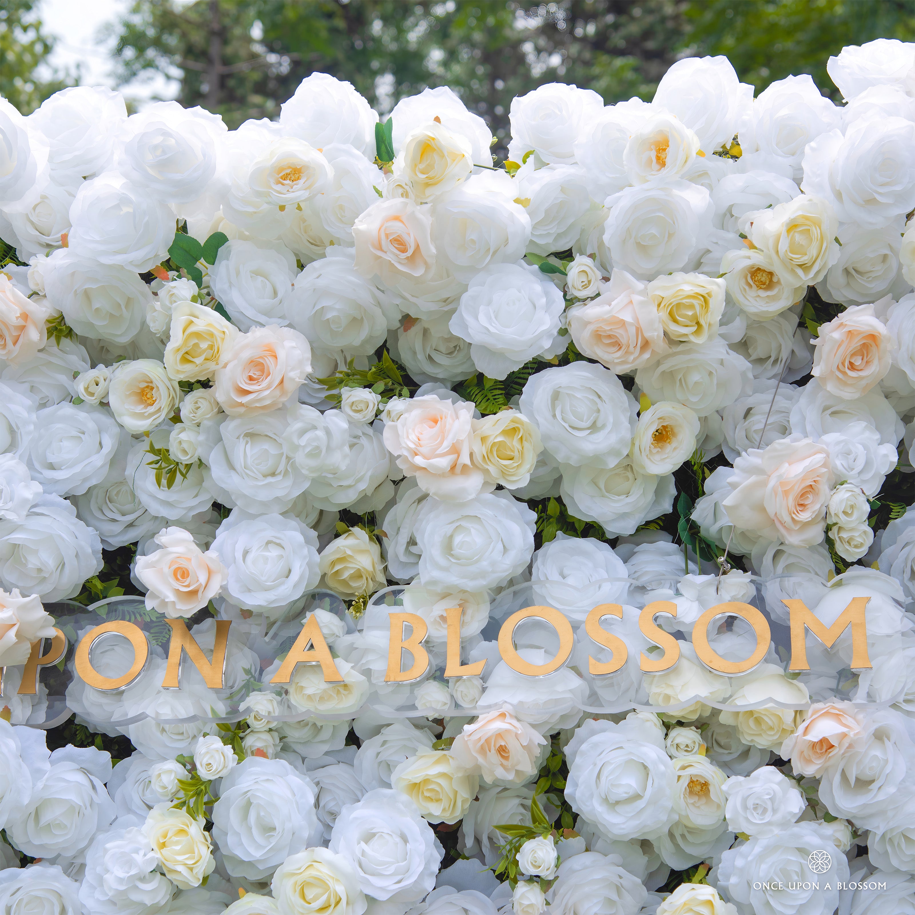 Close-up of layered roses and chrysanthemums on Ever After wedding backdrop
