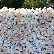 Mid shot of the First Blush white flower wall with blush and champagne roses mixed through, for ceremonies