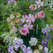 Textured floral detail—Wild Pop arch with bold colors and lush greenery.