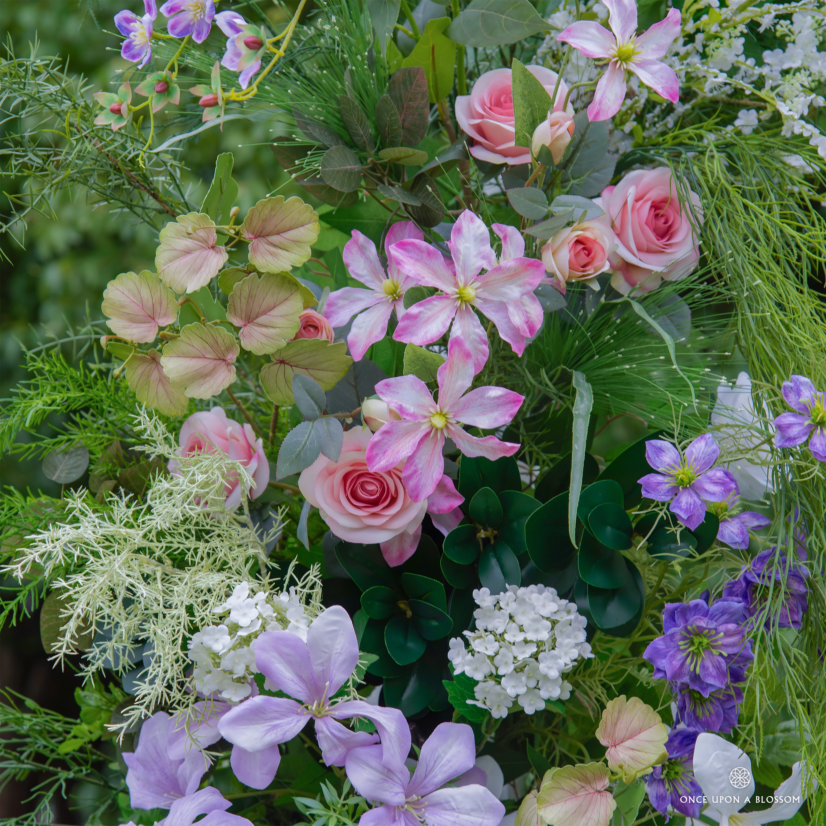 Textured floral detail—Wild Pop arch with bold colors and lush greenery.