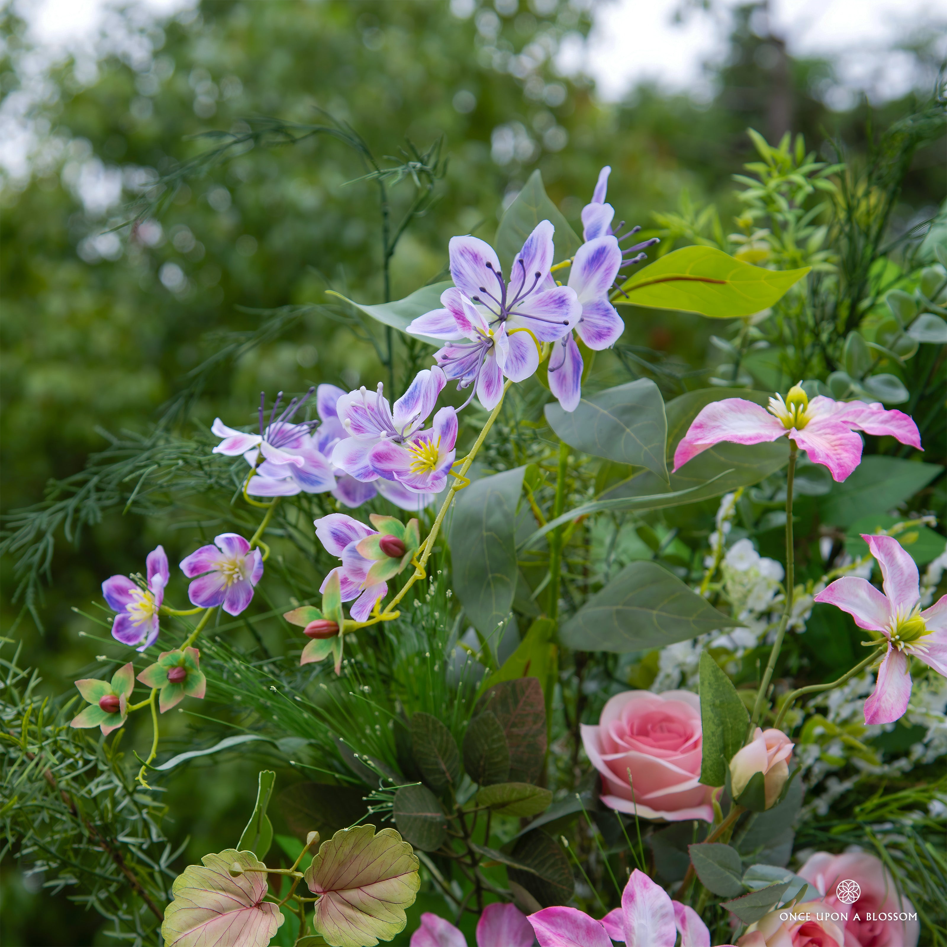 Zoomed view of Wild Pop arch—vivid flowers in blue, orange, and lavender.