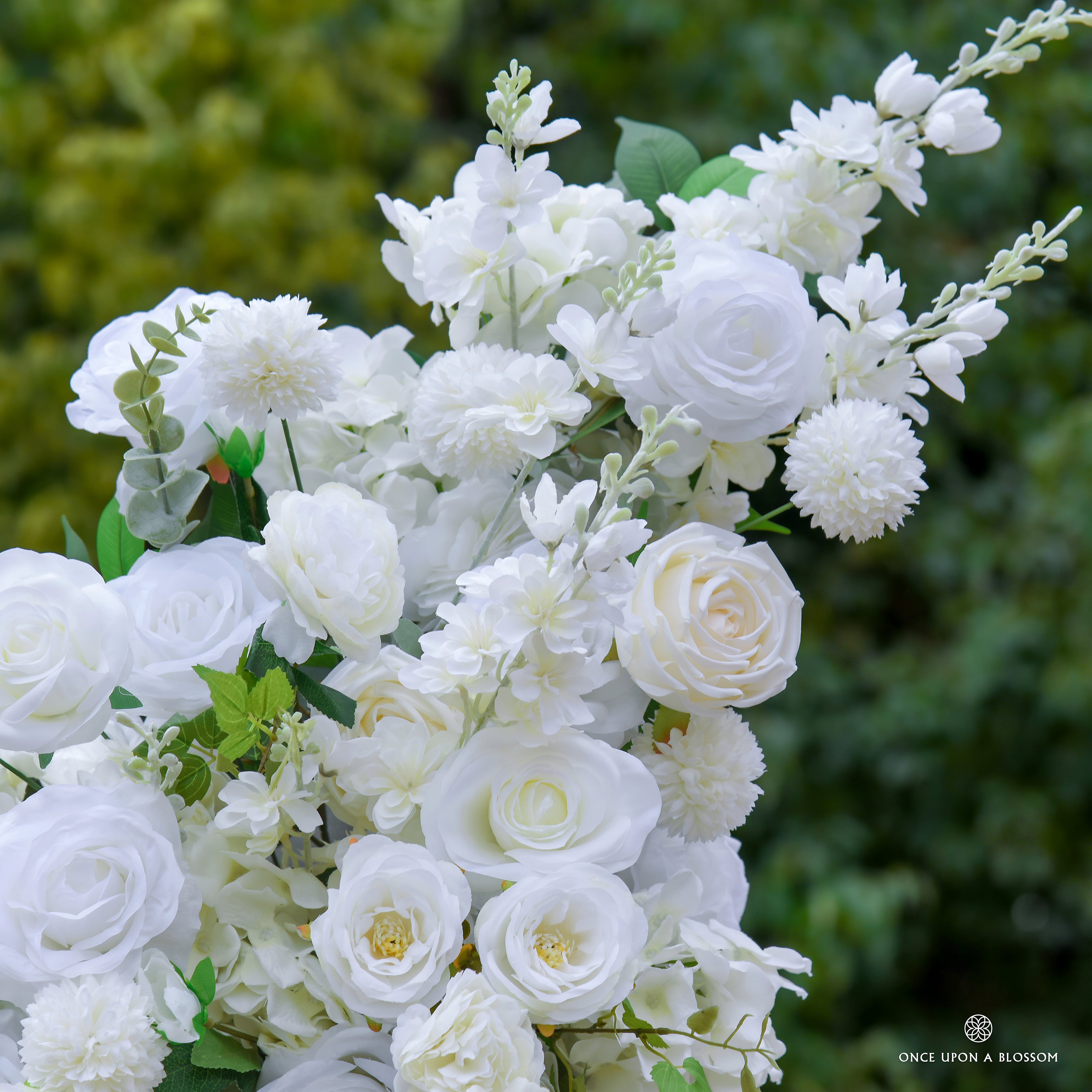flower arch of ivory flowers with green leaves, designed for venues