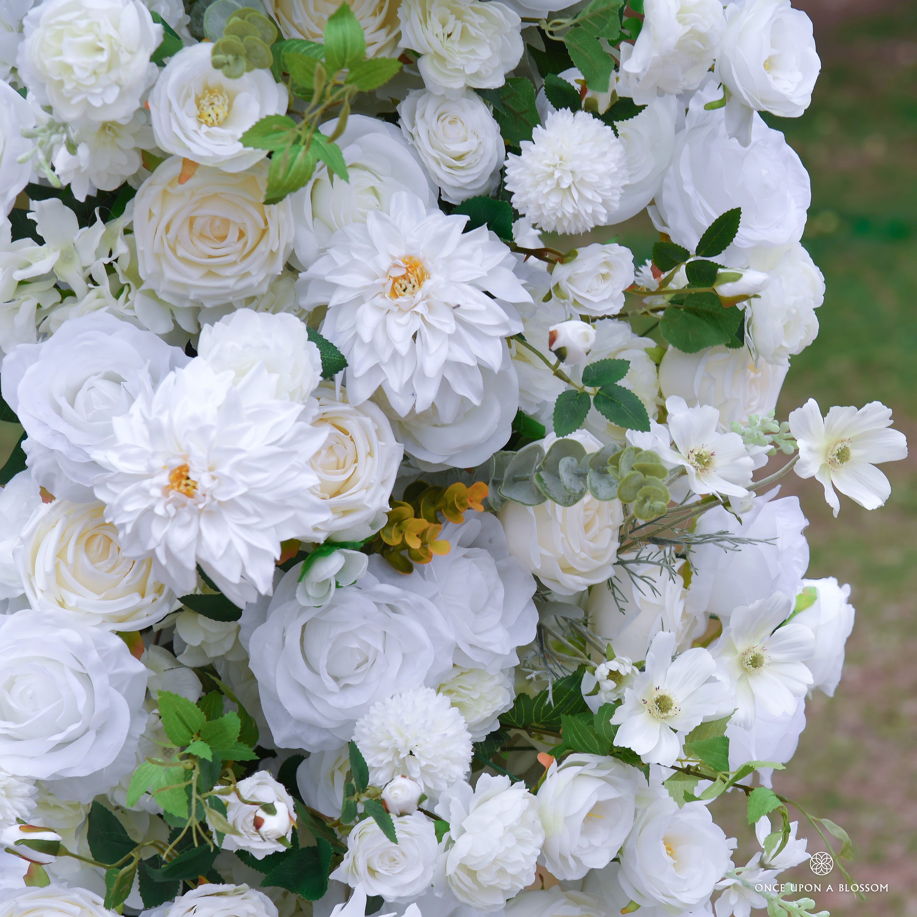 flower arch of white flowers with green leaves, designed for weddings