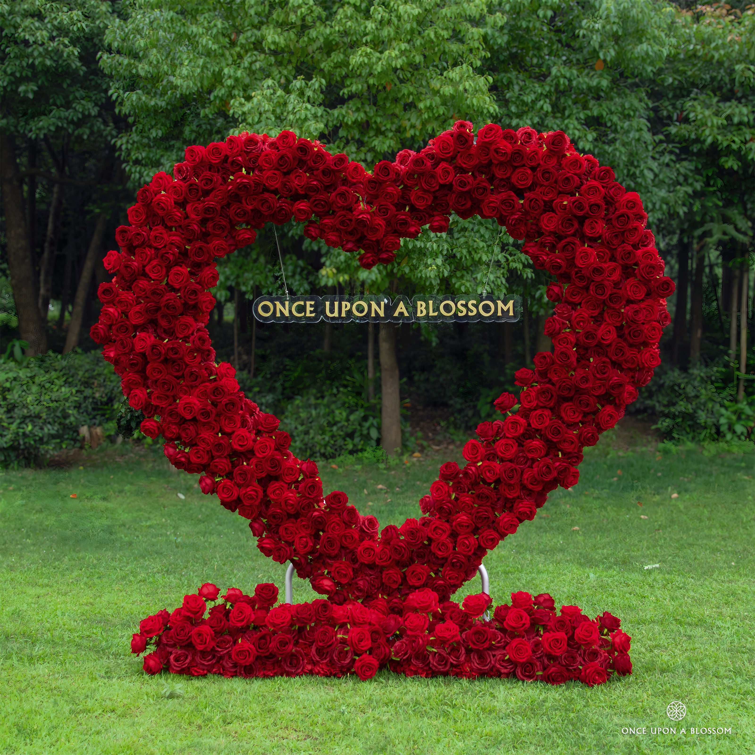 Front view of red heart-shaped flower arch Pulse with deep red silk roses.