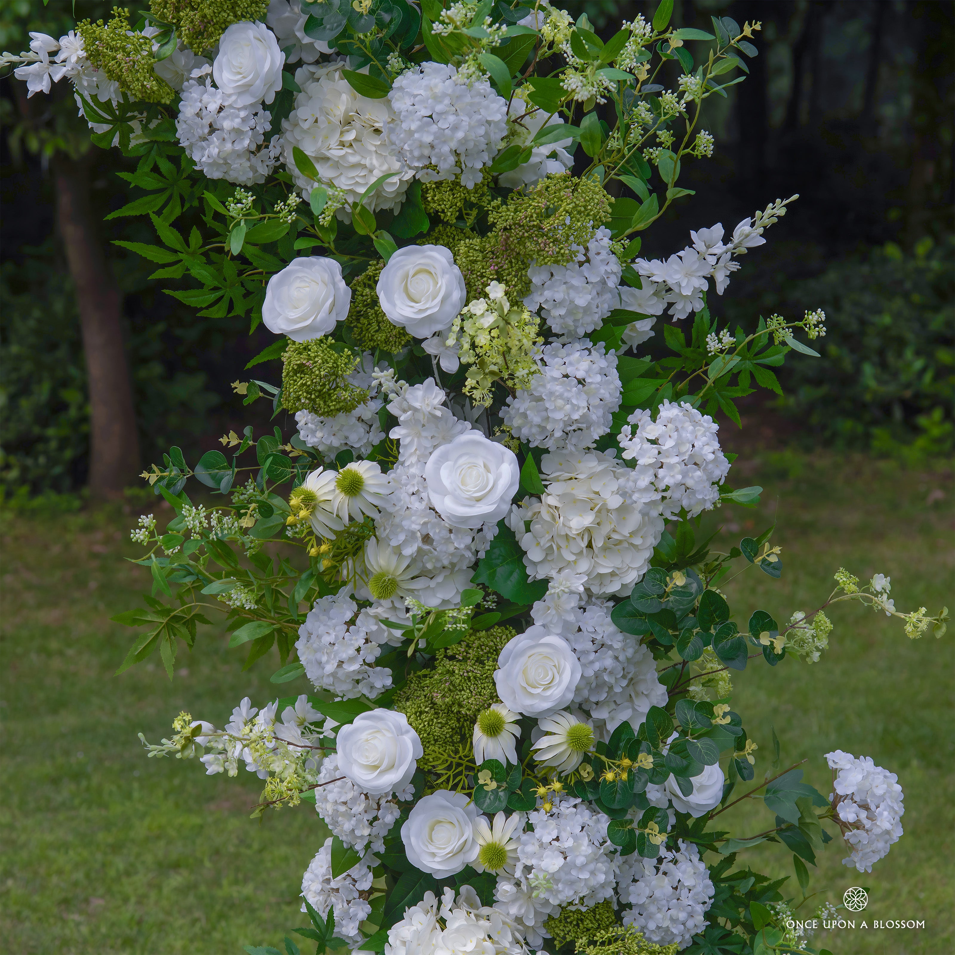 Close-up of Be Here Now arch with premium white roses and hydrangeas.