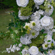 Detail shot of Be Here Now white flower arch—premium materials and design.