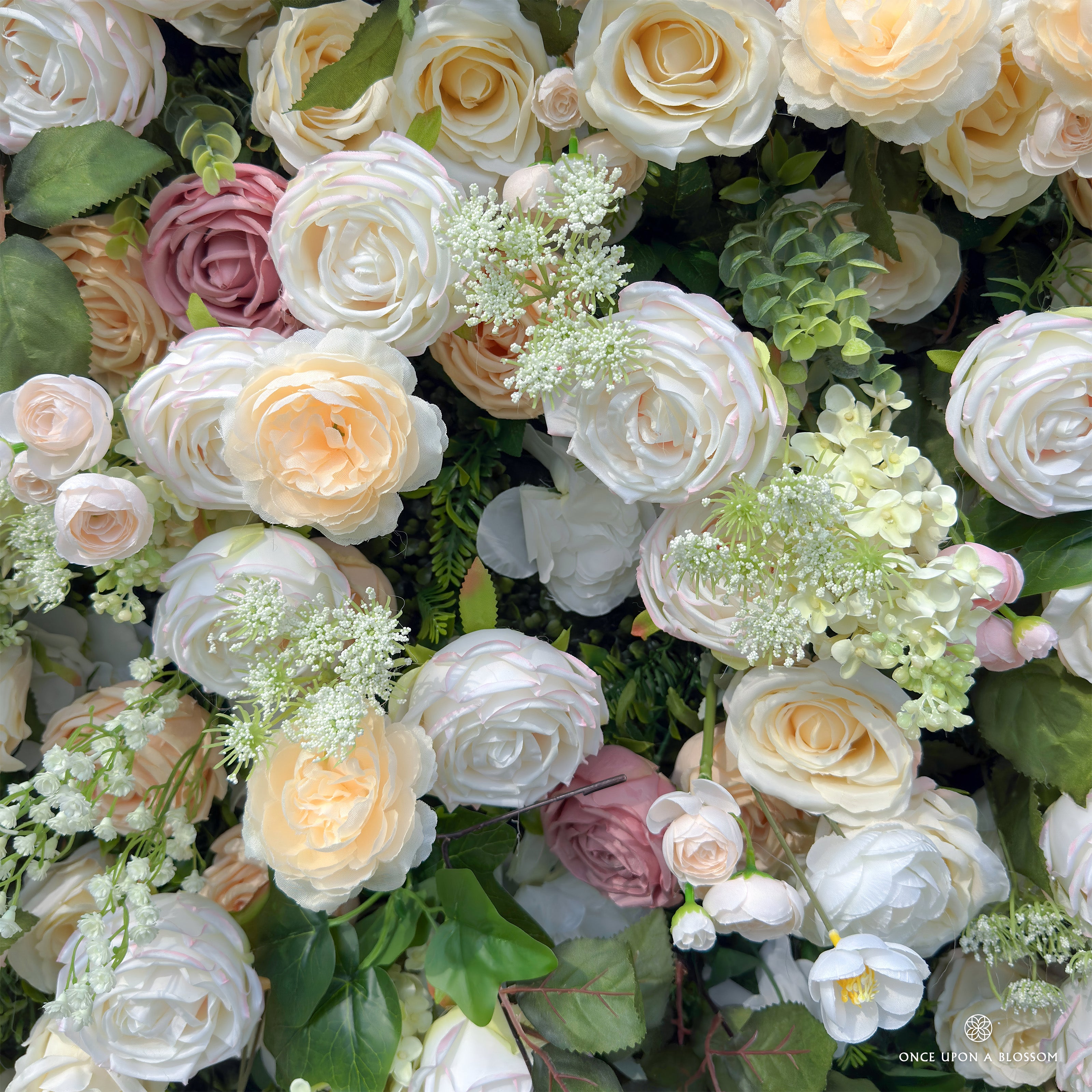 Detailed view of Spring Melody flower wall—champagne and blush florals.