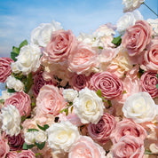 detail shot of petals and foliage of light pink and white flower wall featuring roses, from our Rosé All Day.