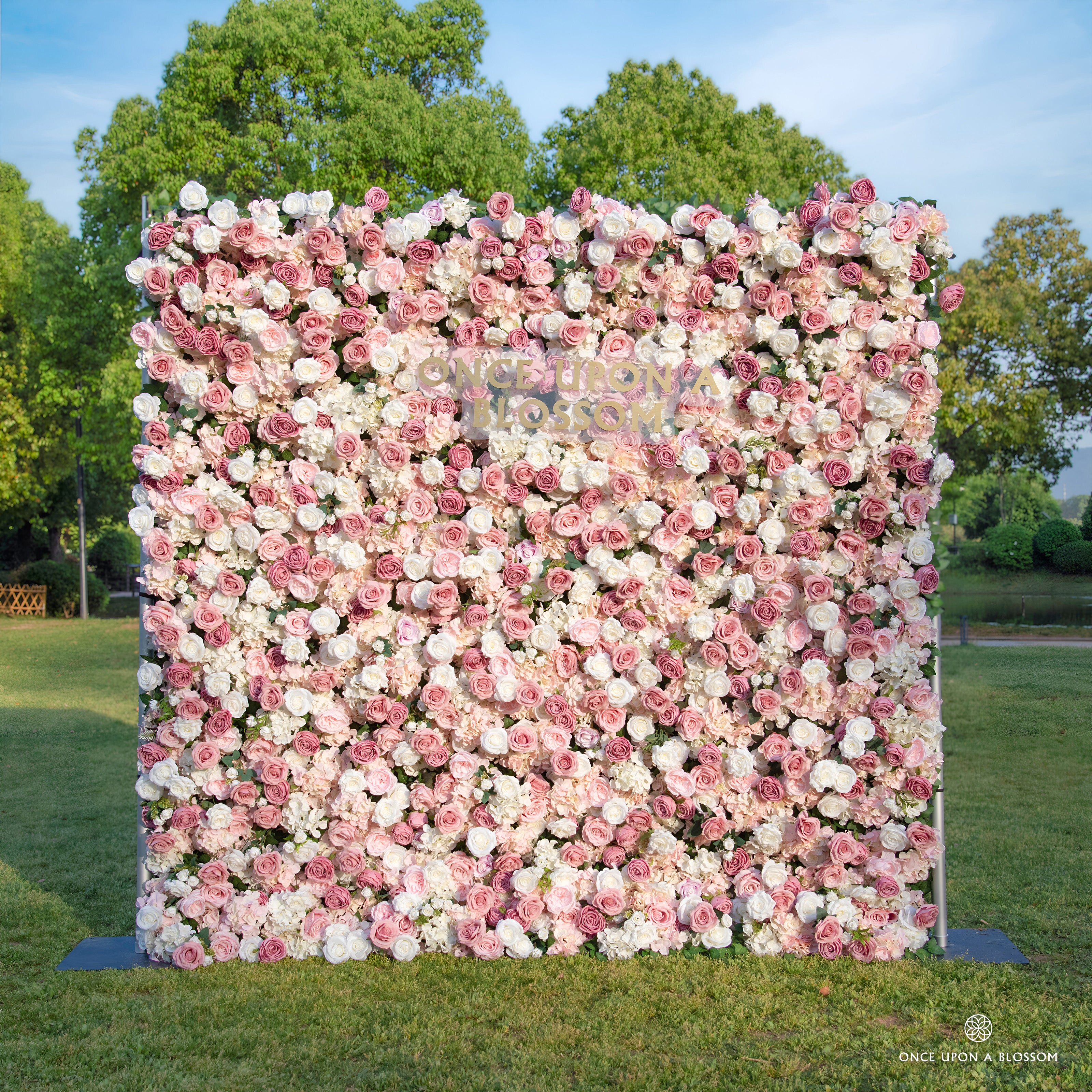 front view of pink and white flower wall featuring roses, from our Rosé All Day.