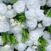 Close-up of white roses and greenery featured on Garden Party photo booth backdrop