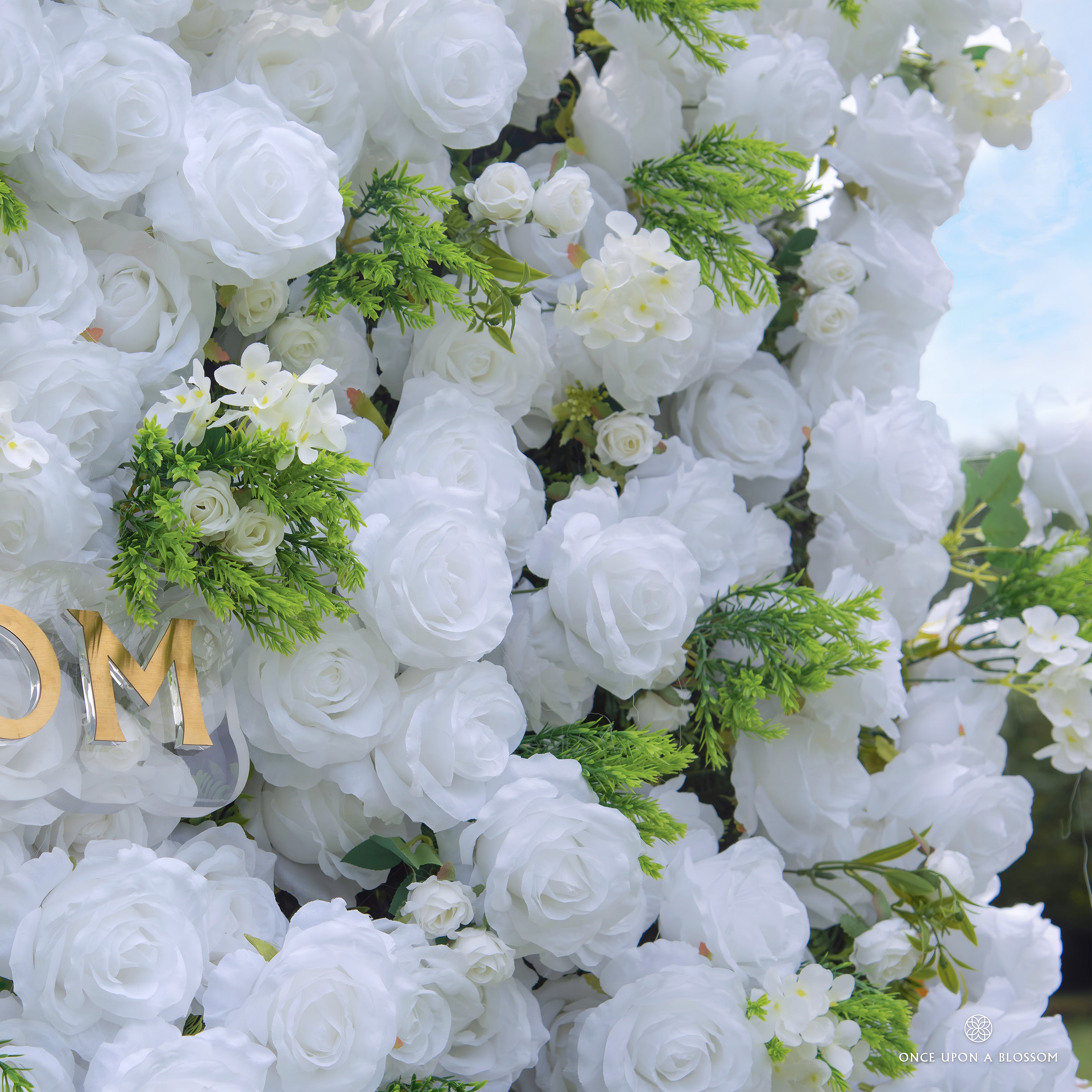 Close-up of Garden Party white flower wall for bridal showers and celebrations