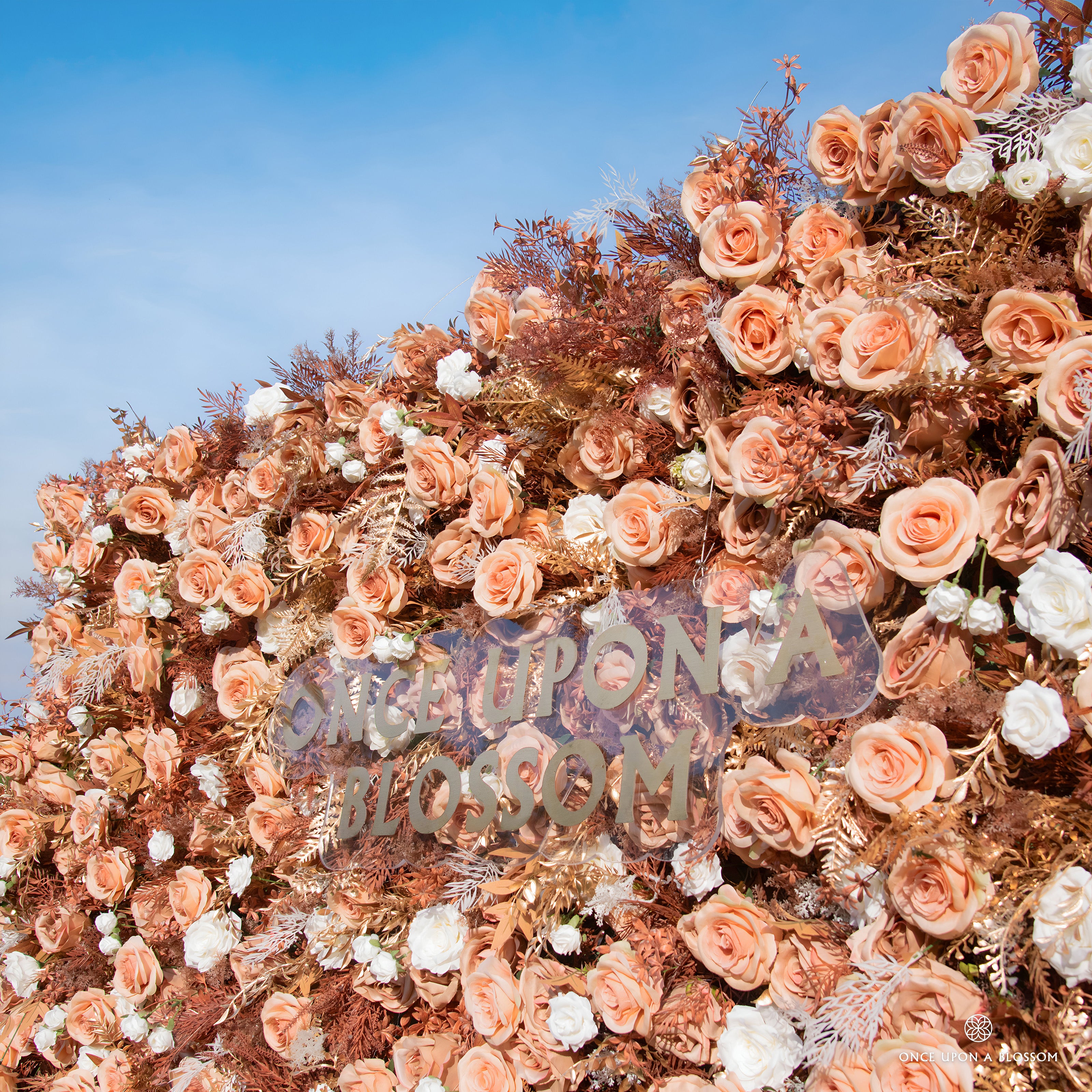 close-up of flower textures of gold, white, and orange flower wall featuring roses and golden leaves, from our Golden Hours.