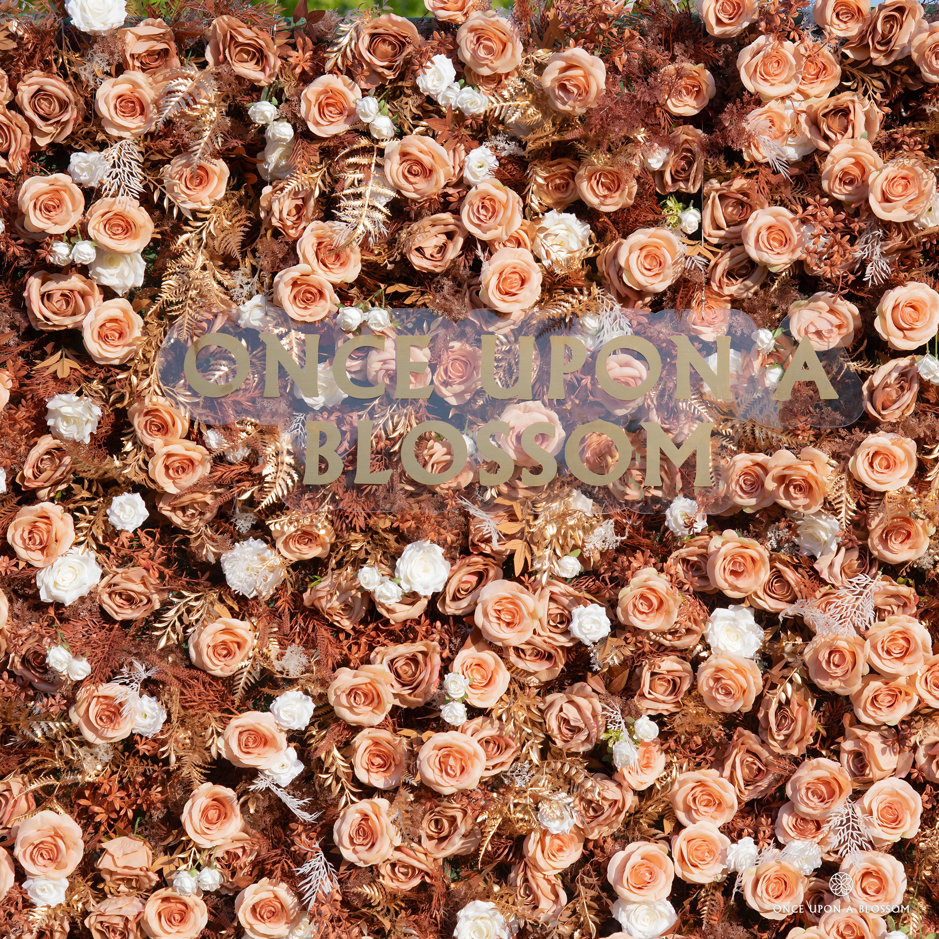 detail shot of petals and foliage of gold, white, and orange flower wall featuring roses and golden leaves, from our Golden Hours.