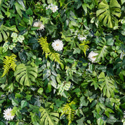 detail shot of petals and foliage of greenery wall featuring chrysanthemums, pothos, and monstera leaves, from our Pearl Garden.