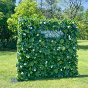 left-side angle of greenery wall featuring chrysanthemums, pothos, and monstera leaves, from our Pearl Garden.