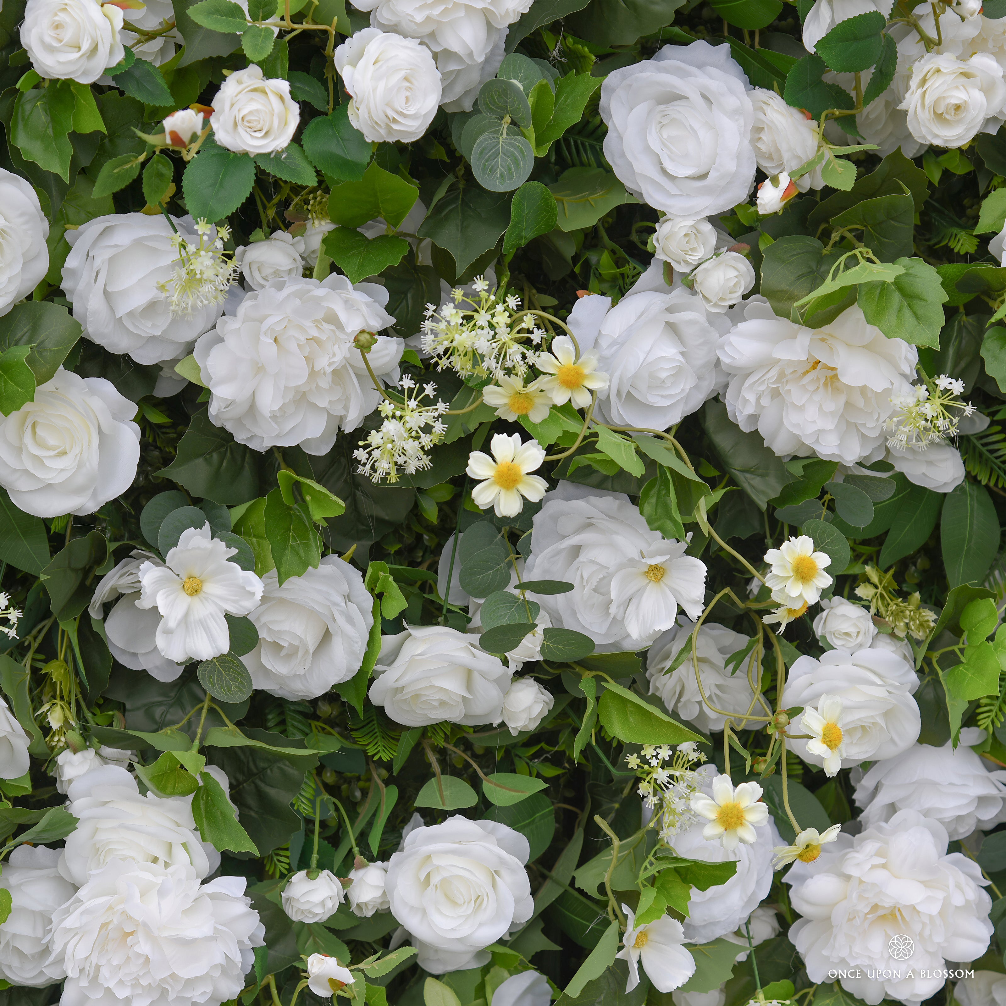 handcrafted white roses on greenery base