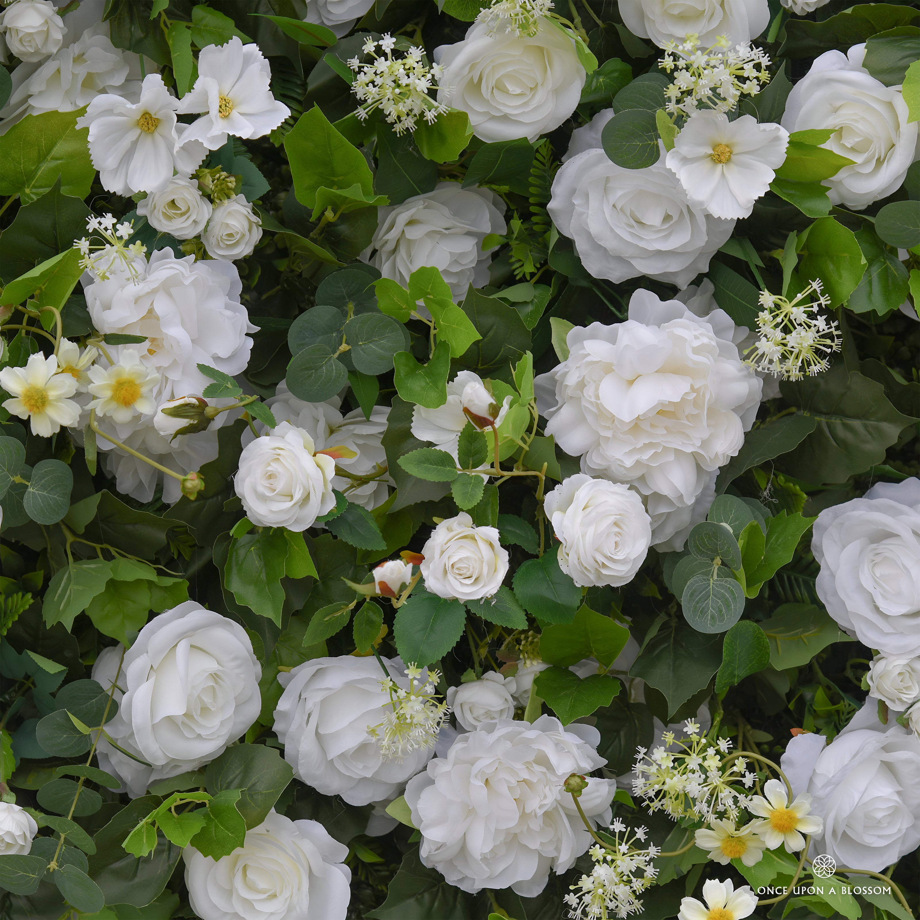Close-up of white flowers and green leaves for once upon a blossom flower wall