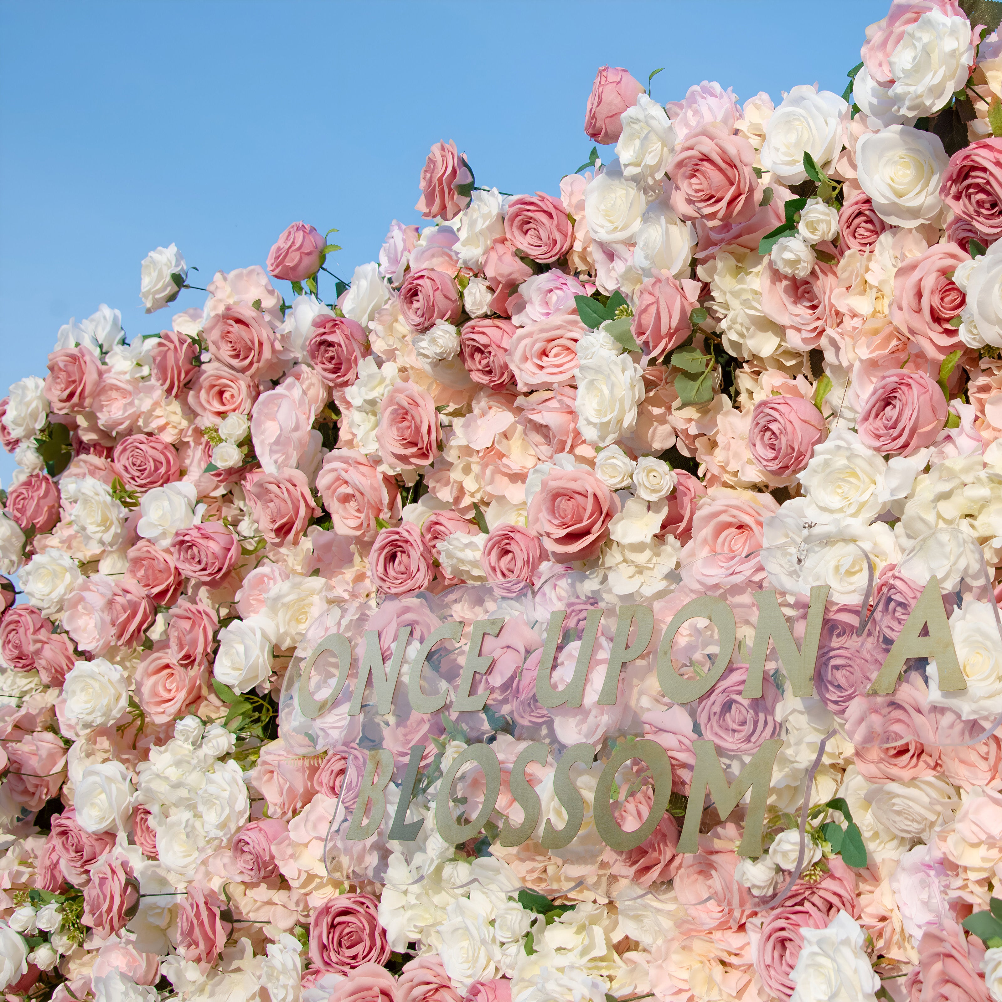 close-up of flower textures of light pink, dark pink, and white flower wall featuring roses, from our Rosé All Day.