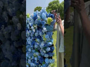 Video of Something Blue flower wall featuring soft blue and white silk roses—elegant, airy, and perfect for baby showers and bridal events.