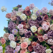 detail shot of petals and foliage of purple, pink, and white flower wall featuring roses, from our Purple Velvet.