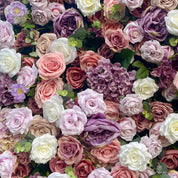 detail shot of petals and foliage of purple, pink, and white flower wall featuring roses, from our Purple Velvet.