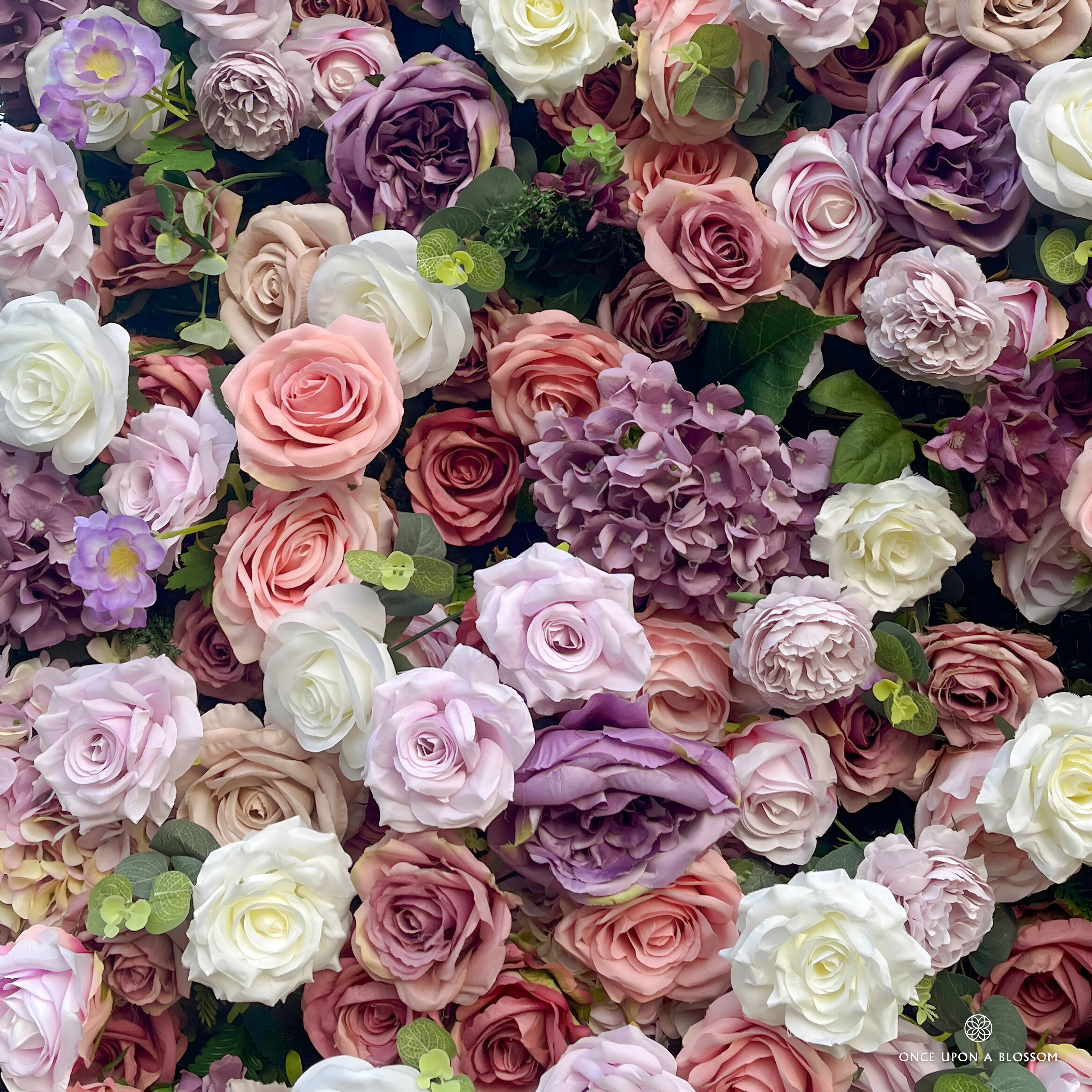 detail shot of petals and foliage of purple, pink, and white flower wall featuring roses, from our Purple Velvet.