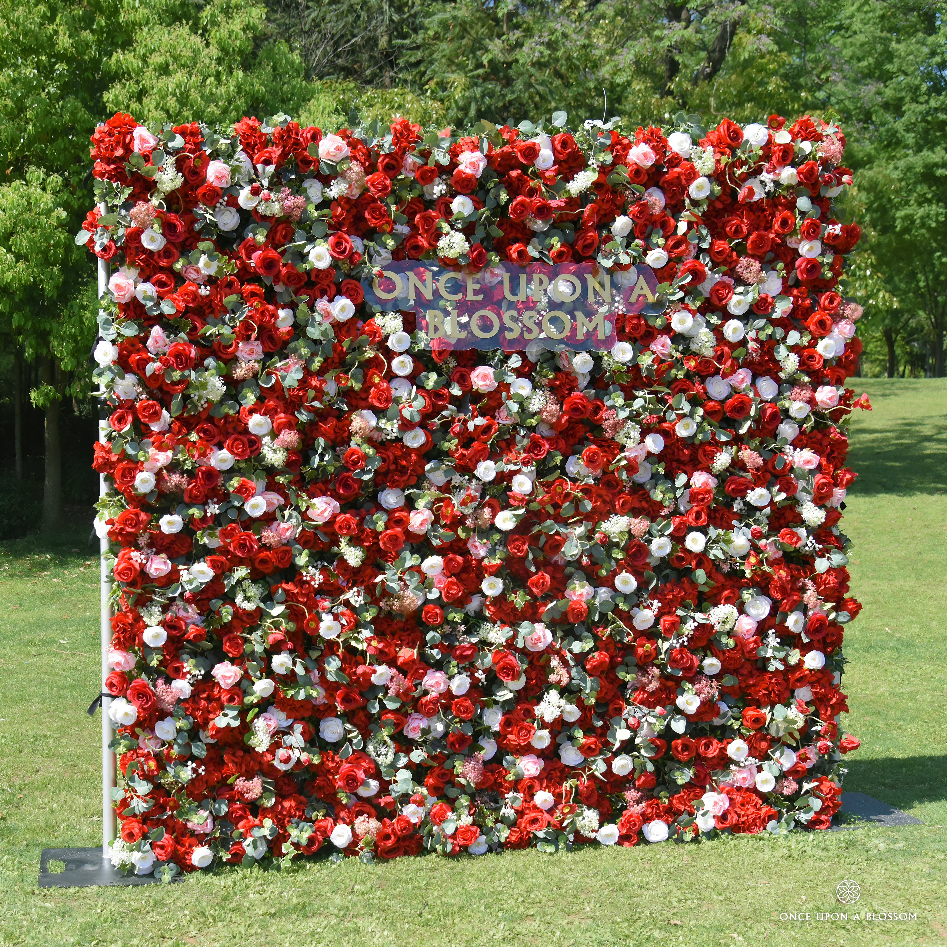 left-side view of red, white, and green flower wall featuring roses and greenery, from our Ruby Rouge.