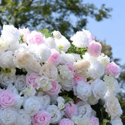 Detail of white, cream, and soft pink roses along the top edge of the Sweet Nothings flower wall