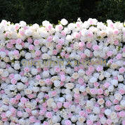 Mid shot of the Sweet Nothings pink and white flower wall, light pink roses scattered evenly through white blooms