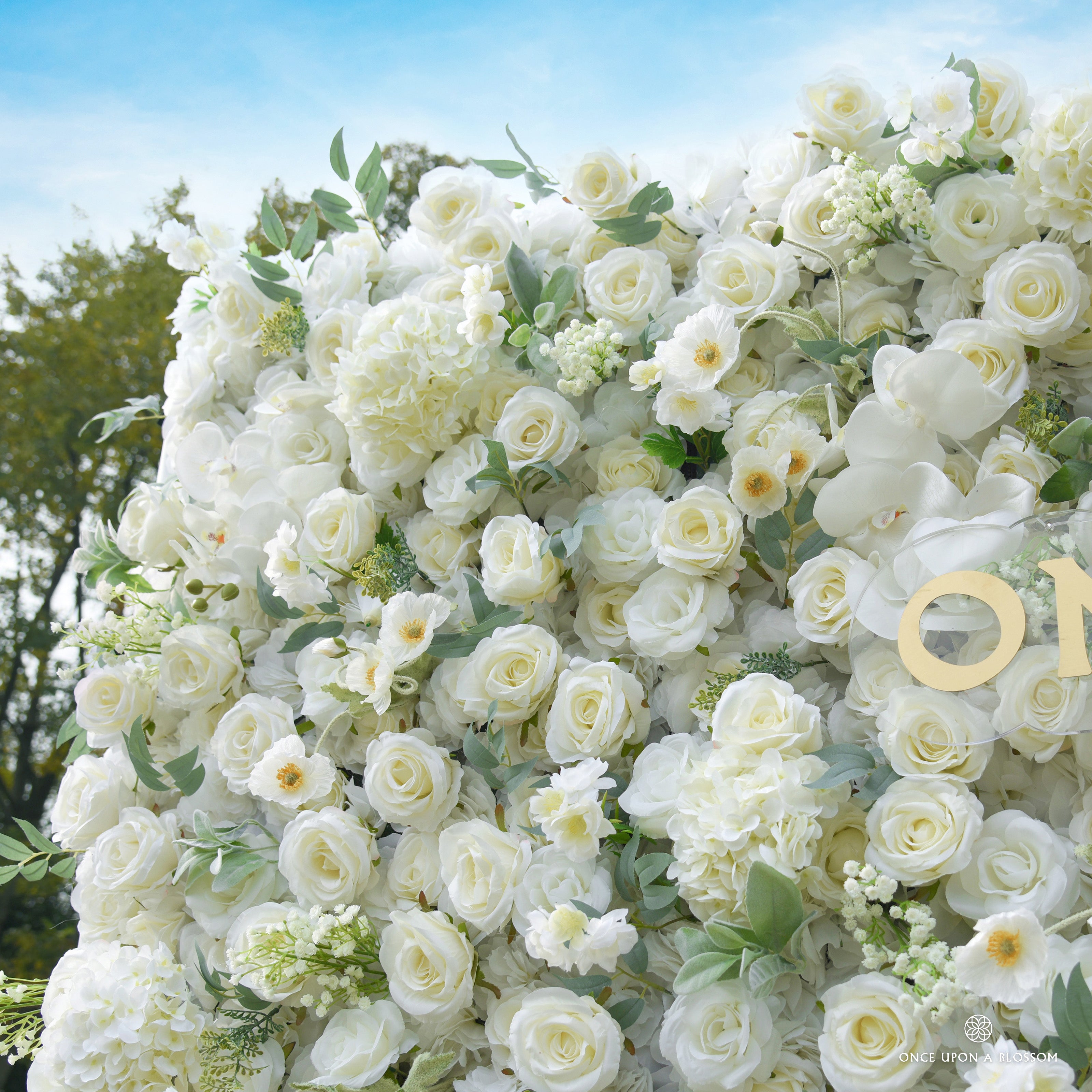 close-up of flower textures of ivory and green flower wall featuring roses and greenery, from our Moonlit Garden.