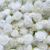 detail shot of petals and foliage of white flower wall featuring white roses, from our Angel’s Breath.
